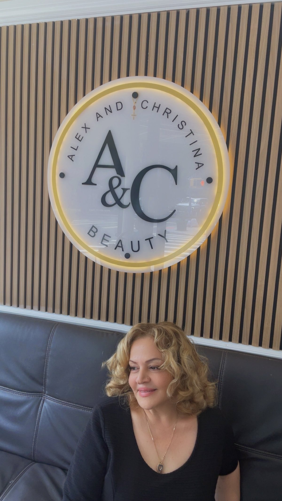 Short blonde curled hairstyle created at A&C Beauty Salon