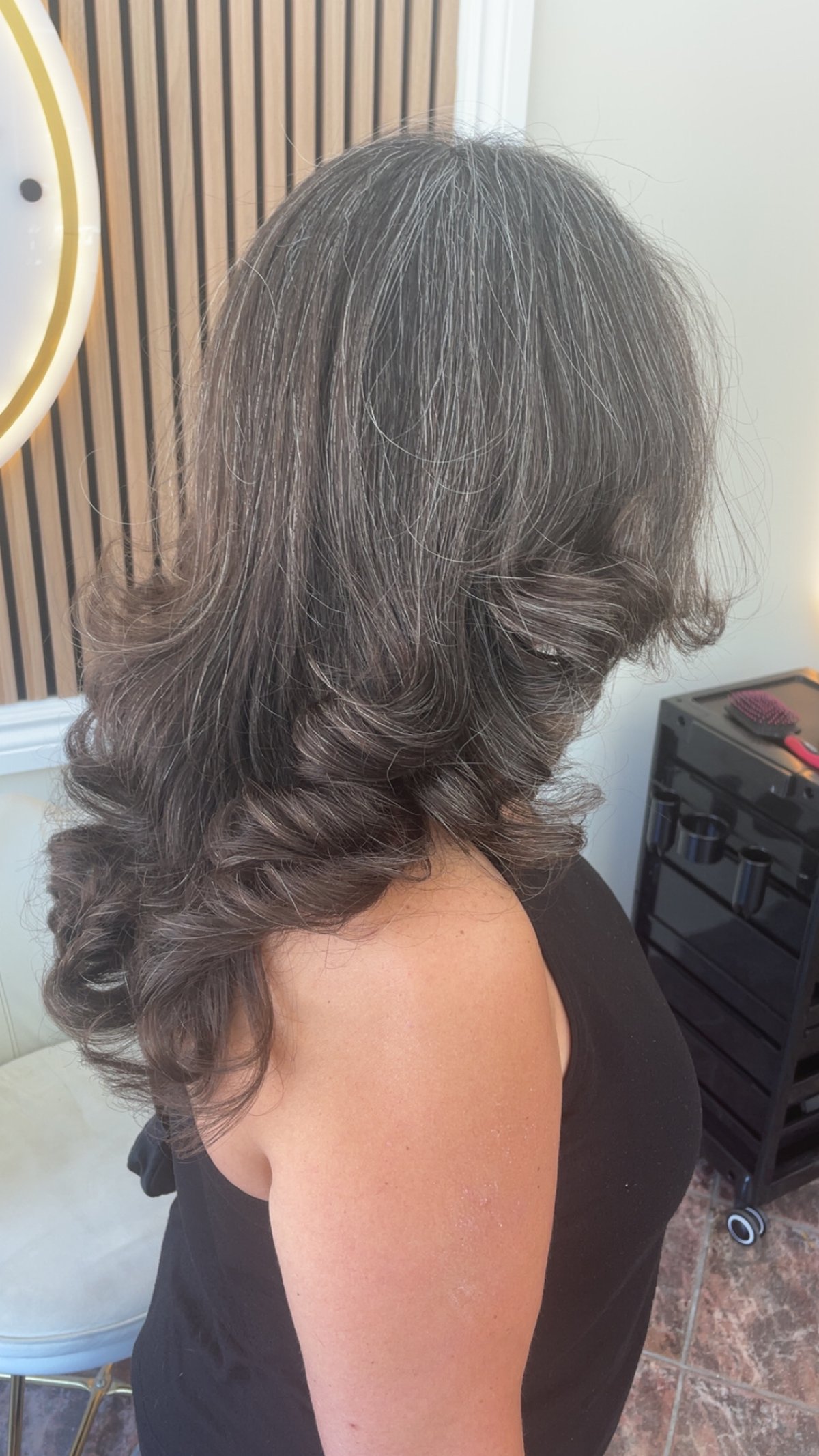 Dark layered blowout created at A&C Beauty Salon